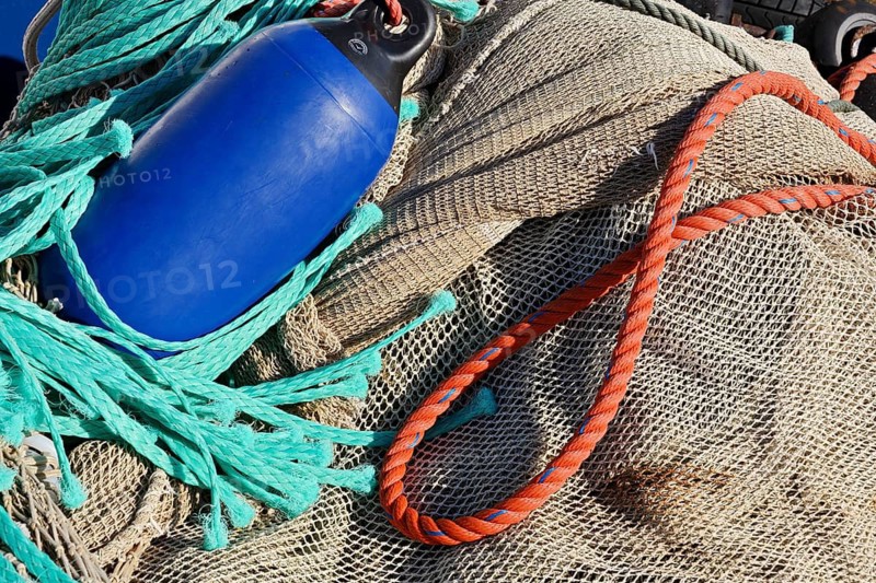 Fishing net with buoy and ropes in harbour, Neuharlingersiel, East Frisia, Lower Saxony, Germany