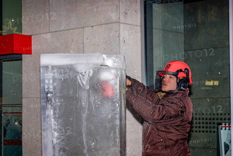 An ice sculpture is being created: ice carving street action as part of the long shopping night in the city center of Reutlingen, Baden-Württemberg, Germany, for editorial use only