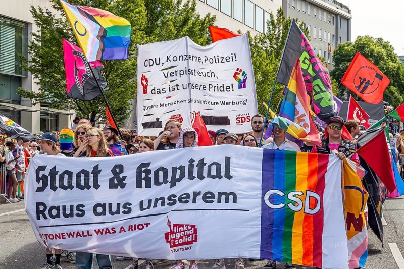Critical voices from left-wing youth solid. The platform demands an exclusion of CDU, police, corporations from Pride. Banner Staat und Kapigal Get out of our CSD., CSD demo moves through Stuttgart. Under the motto Without us, no we! Loud for each other, strong together, the LGBTIQA community in Stuttgart is sending a political signal. Tens of thousands of spectators lined the streets of the city center. Stuttgart, Baden-Württemberg, Germany