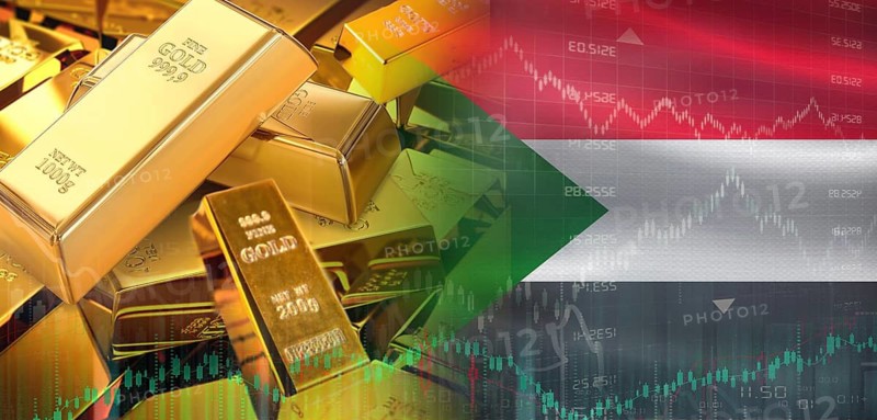 Gold bars stacked on Sudanese flag. Sudan gold reserves, Concept