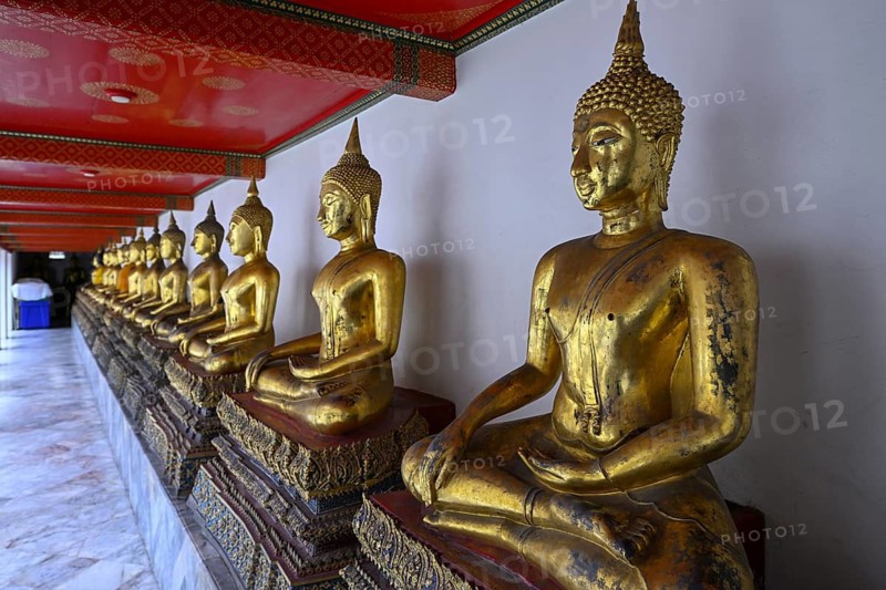 Gilded Buddha statues in Wat Pho, Temple of the Reclining Buddha, Bangkok, Thailand