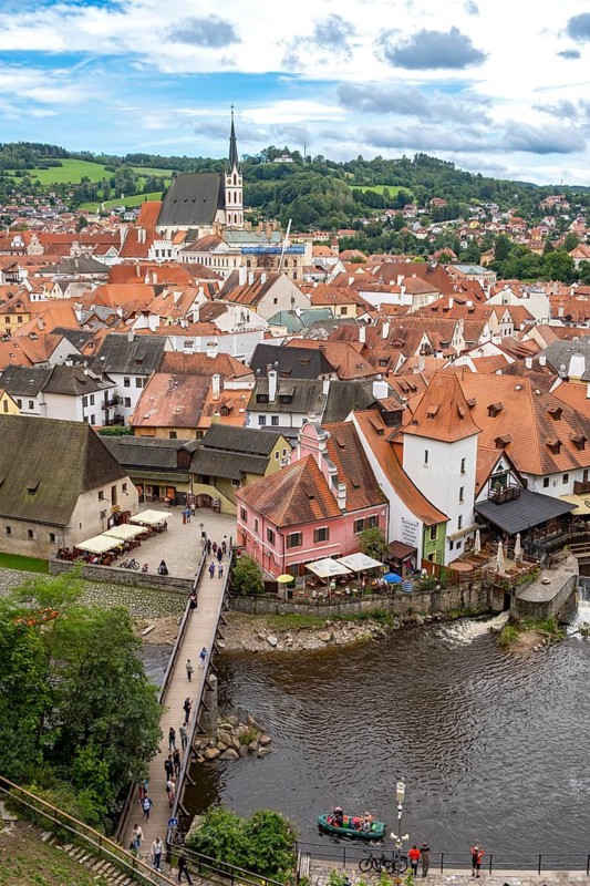 Aerial view of the historic centre of Ceský Krumlov town with bridge, Vltava river, and church steeple, Cesky Krumlov, Czech Republic