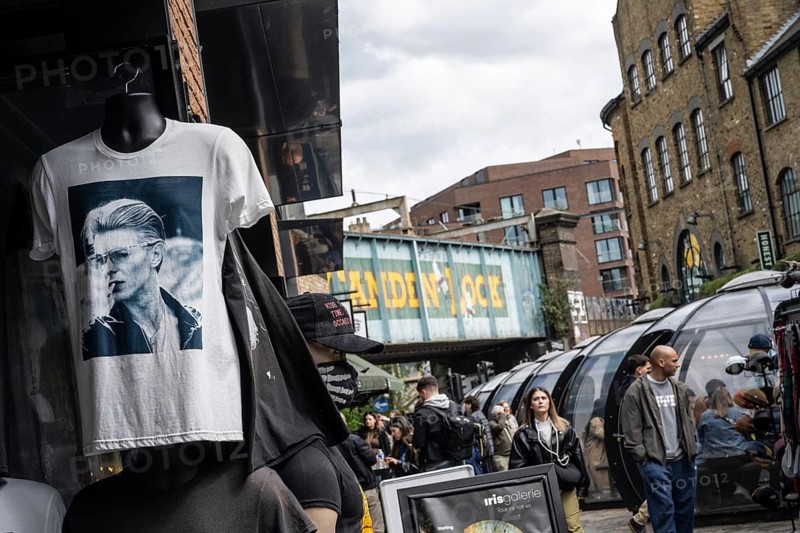 London, United Kingdom. April 17th 2026. A David Bowie T shirt for sale near the iconic Camden Lock bridge over Camden High Street, a busy market popular with street food stalls and alternative shops catering for music and fashion culture. London, UK