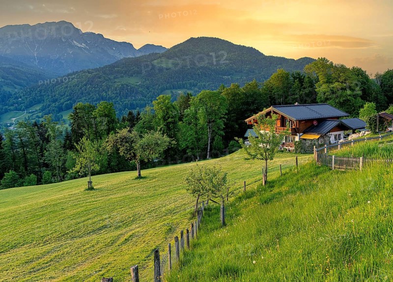 Landscape with meadows, farmhouse and mountains, Berchtesgaden, Bavaria, Germany