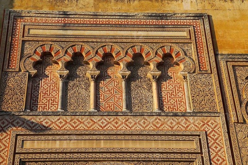 Moorish doorway arches elaborately inscribed stonework of the mezquita Great Mosque, Cordoba, Spain