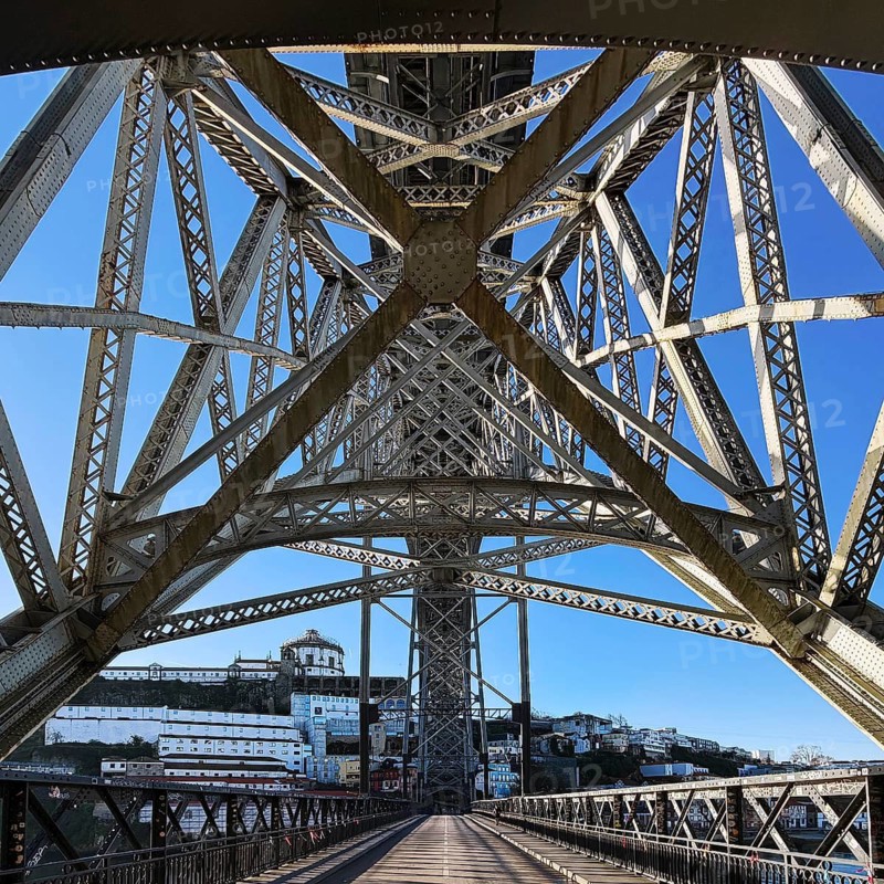 Ponte Dom Luis I arched bridge designed by Théophile Seyrig, looking up from the lower level towards Vila Nova de Gaia, Porto, Portugal