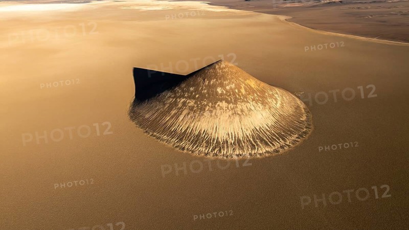Top view, the Cono de Arita is captured in stunning detail, set amidst the sprawling sands of Salta, Argentina, highlighting its unique, natural cone structure