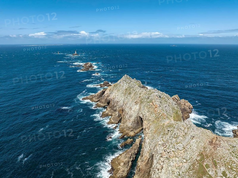 Aerial view of Pointe du Raz with the Phare de la Vieille lighthouse in front of a rocky island, Pointe du Raz, Finistère, Brittany, France