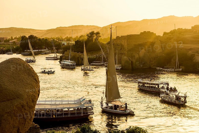 Boats and feluks on the Nile, sunset, Aswan, Upper Egypt, Egypt