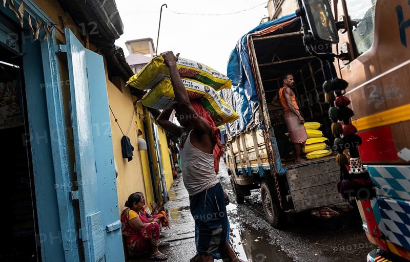 GUWAHATI, INDIA - MAY 1: Labourers carries goods in a wholesale market, in Guwahati, India, on May 1, 2025. May Day or Workers Day is a global holiday celebrated on May 1st to honor workers and their contributions