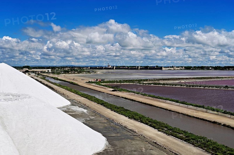 White salt cone, salt marshes, Salins du Midi, behind the historic city wall, Aigues-Mortes, Camargue, southern France, France