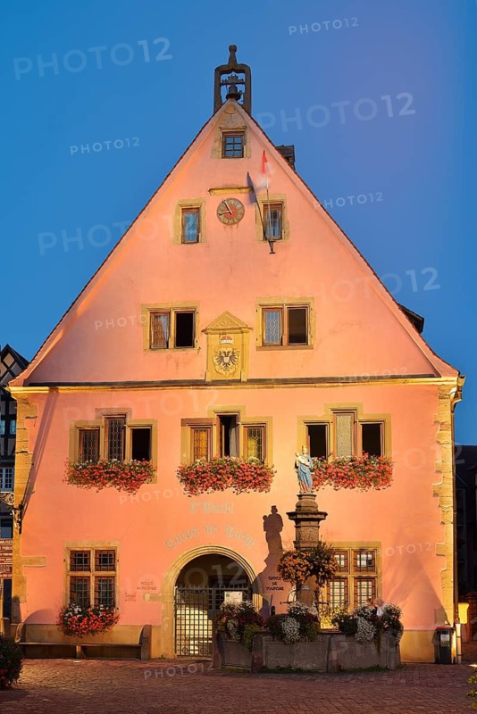 Bürgerstube and fountain with a statue of the Virgin in the evening, Turckheim, Haut-Rhin, Alsace, Grand Est, France
