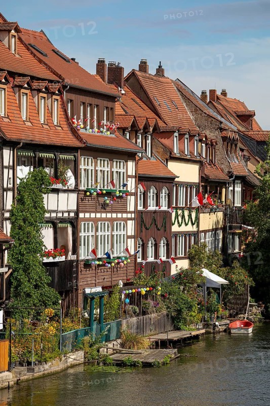 20 August 2026, decorated historic half-timbered houses along the Regnitz river during the Sandkerwa festival in Bamberg, Bavaria, Germany