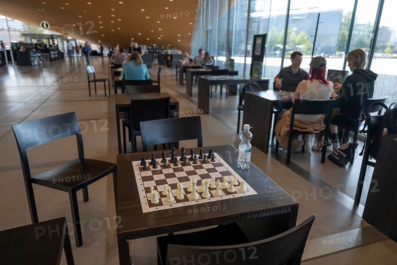 Chess set on a table, ground floor, Oodi Central Library and Cultural Centre, design by ALA Architects, Helsinki, Finland