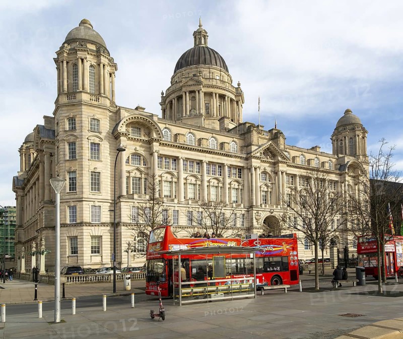 Port of LIverpool building, Pier Head, Liverpool, England, UK completed 1907 architect Sir Arnold Thornely red double-decker tour bus