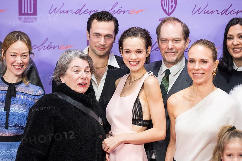 Emilia Schüle (actress) and Anneke Kim Sarnau (actress) surrounded by other filmmakers at the premiere of the film Wunderschöner at Berlin's Zoo Palast on 4 February 2025
