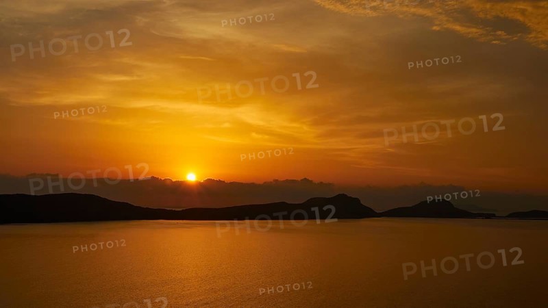 A peaceful sunset, the sun disappears behind the hills, Navarino Bay, Pylos, Peloponnese, Greece