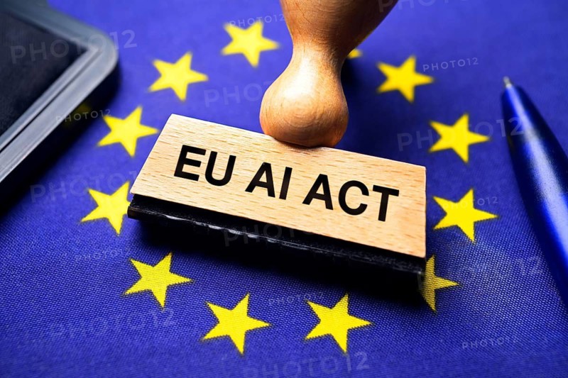 EU AI Act stamp on EU flag, photo montage +++ editorial use only