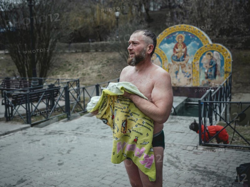 Man after a morning swim in a public bathing facility in Severno Saltivka. The neighbourhood was extensively destroyed by Russian missile attacks, Severno Saltivka, Kharkiv, Ukraine