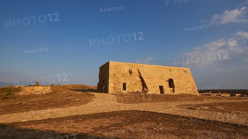 Drone shot, Fortezza, Venetian sea fortress, building inside the fortress, blue sky, few grey-white clouds, Rethimnon, central Crete, island of Crete, Greece