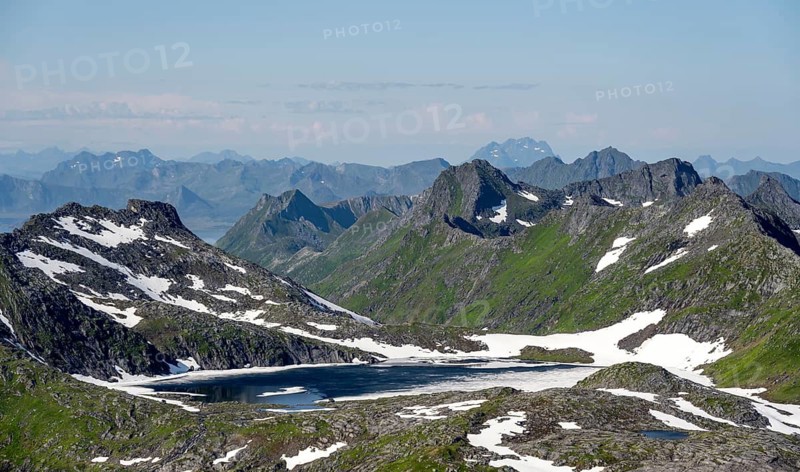 Mountain peak and lake, view at the summit of Rundfjellet, Svolvaer, Nordland, Norway