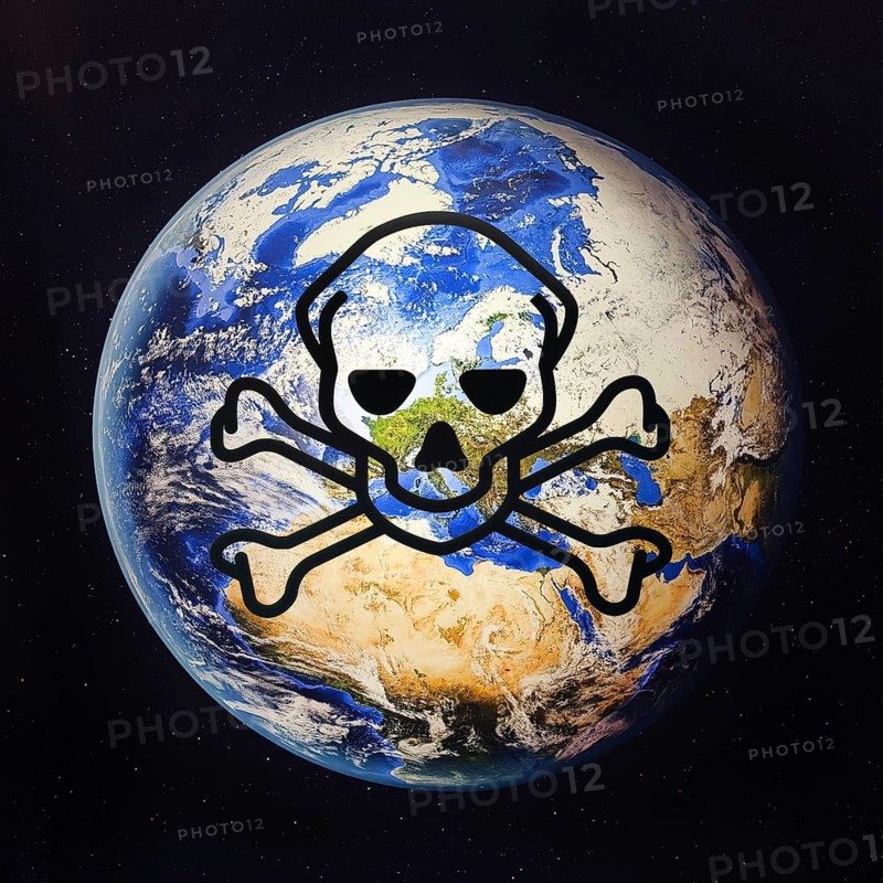 Photo montage Dangerous Goods Sign Skull with Crossbones on Earth seen from space