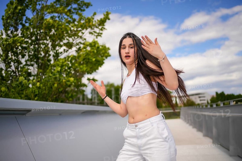 Vital beauty caucasian young woman dancing freestyle in an urban park