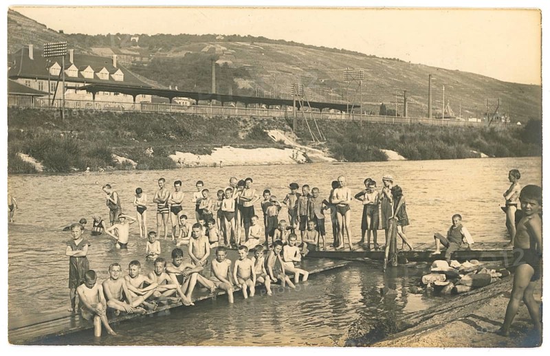 Bathing, swimwear, leisure, summer, swimming, boys, girls, river, group of children bathing in a river with mountains in the background, 1920