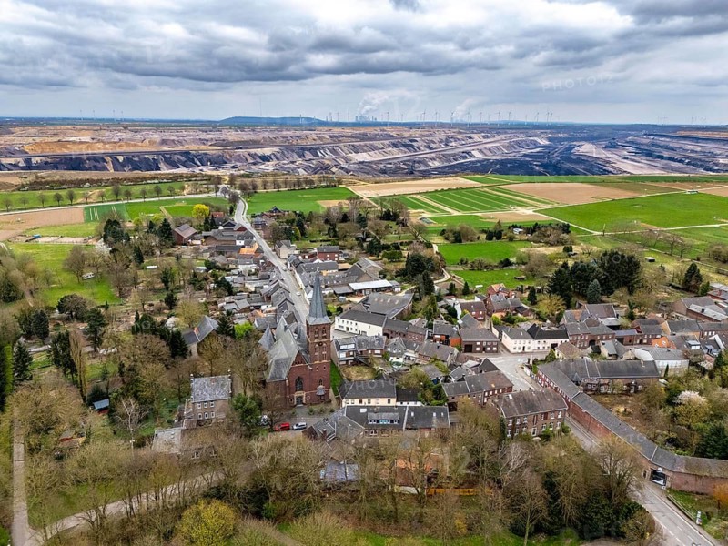 The village of Keyenberg at the Garzweiler II open-cast lignite mining area, the original village was to be dredged, but now remains due to the lignite phase-out in 2030, the former residents now live around 6 kilometres away in the district of Erkelenz, in Keyenberg-Neu, North Rhine-Westphalia, Germany