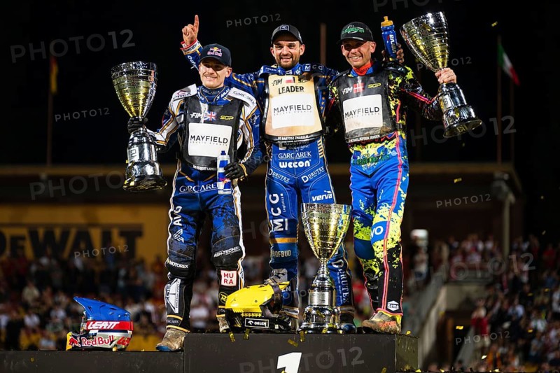 WROCLAW, POLAND - JUNE 20, 2026: DEWALT FIM Speedway GP of Poland. Speedway riders celebrating victory with trophy after race. Joy winnersylwetka silhouette 2. Robert Lambert 1. Bartosz Zmarzlik 3. Michael Jepsen Jensen