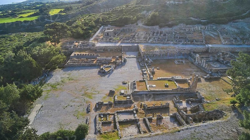 Drone shot, first morning light, Ancient ruins of an archaeological site surrounded by green nature and mountains in daylight, Kamiros, Archaeological site, Ancient city, Foundation of Doric Greeks, Rhodes, Dodecanese, Greek Islands, Greece