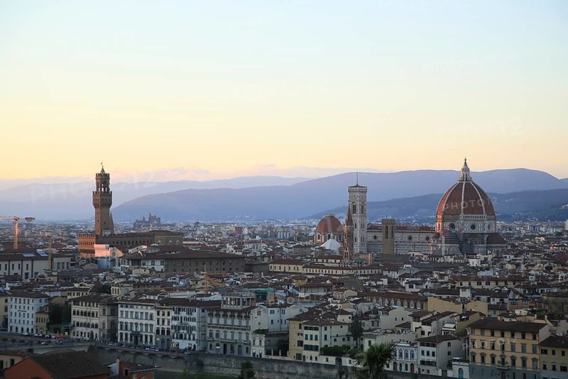 Panoramic view of Florence at dusk with the cathedral and surrounding historic buildings, sunset panorama with Arno, Florence, Tuscany, Italy