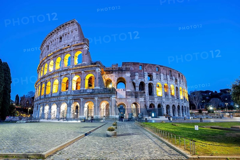 Colosseum ancient amphitheatre at night in Rome, Italy