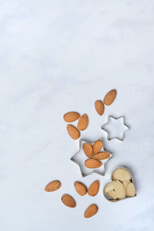 Almonds and biscuit cutters for biscuits, almond kernels