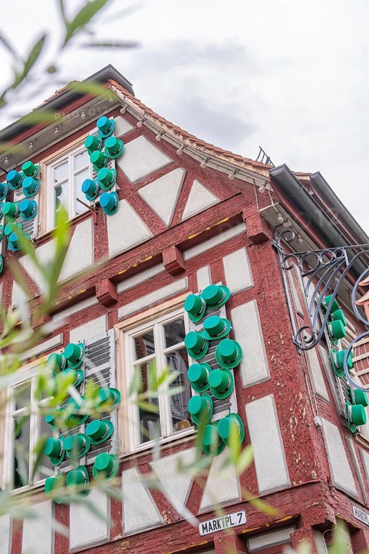 Detailed view of a half-timbered house with decorative green elements, Kirchheim Teck, Germany