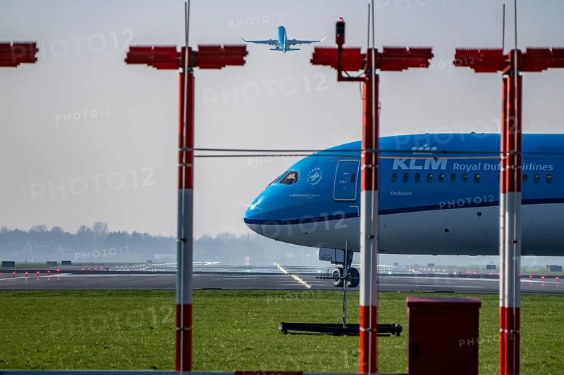 Amsterdam Schiphol Airport, Aalsmeerbaan runway, 18L-36R, KLMflieger on the runway, waiting for take-off, other aircraft taking off, Netherlands