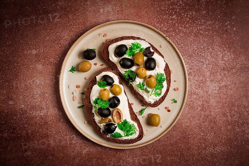 Breakfast, sandwiches, with cream cheese, olives, top view