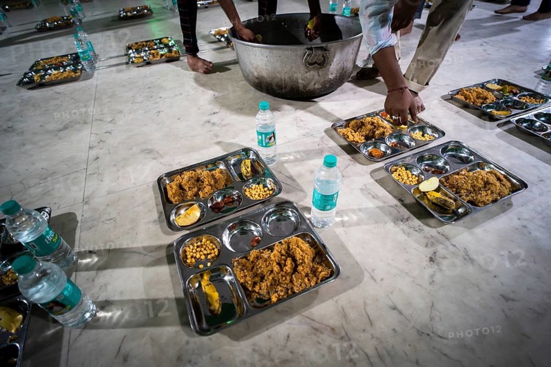 GUWAHATI, INDIA - MARCH 2: Arranged rows of food plates, for Ramadan's first Iftar during Muslim holy month of Ramadan in Guwahati, India on March 2, 2025