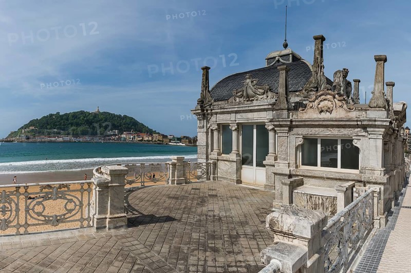 Summer at La Concha beach with historic bathhouse La Perla, San Sebastian, Basque Country, Spain