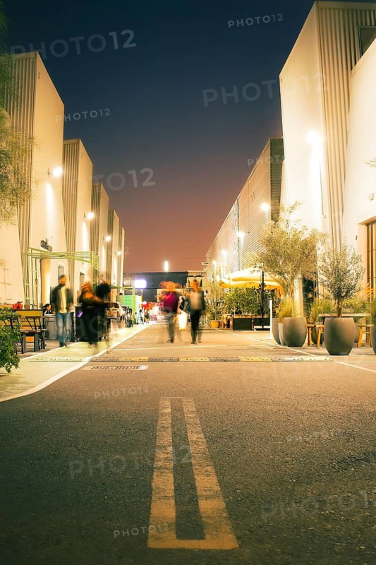 Dubai, UAE - 16th january, 2026: Alserkal Avenue at night in Al Quoz. Visitors visit Industrial galleries, shops, cafes and creative hubs illuminated under festive string lights