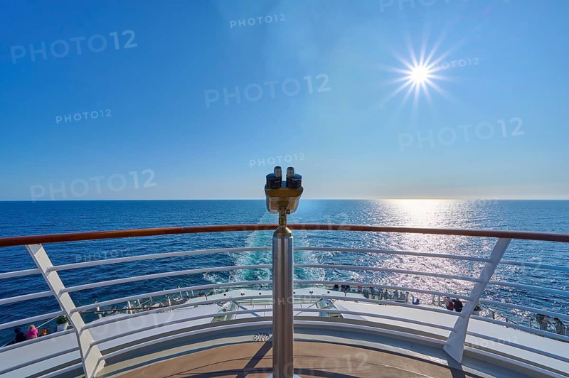 View from the ship's deck, Mein Schiff 6, under bright sunshine and blue sky, binoculars at the stern, North Sea, Norway