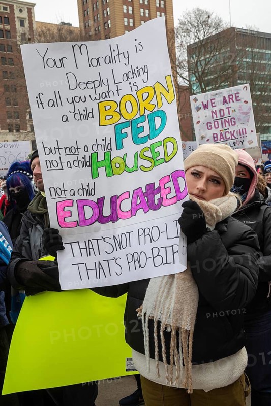 Lansing, Michigan USA - 5 February 2025 - People rally at the Michigan state capitol to oppose President Trump, Elon Musk, and Project 2025. Similar rallies were planned across the country, many of them at state capitols
