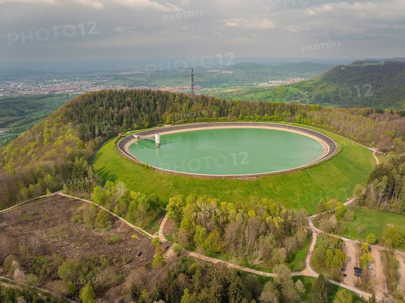 Upper reservoir, round reservoir in a hilly, wooded landscape with a strong connection to nature, Glems reservoir, Swabian Alb, Germany