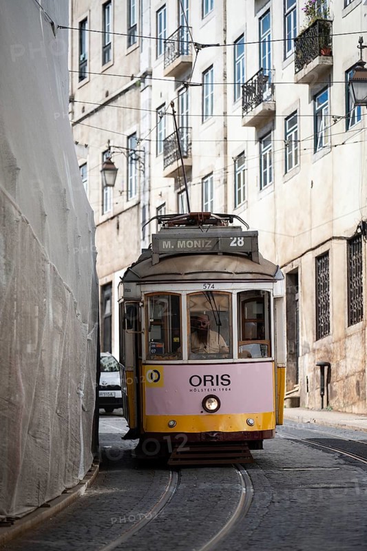 LISBON, PORTUGAL - MAY 19, 2025: Famous tram number 28 at the street of Lisbon