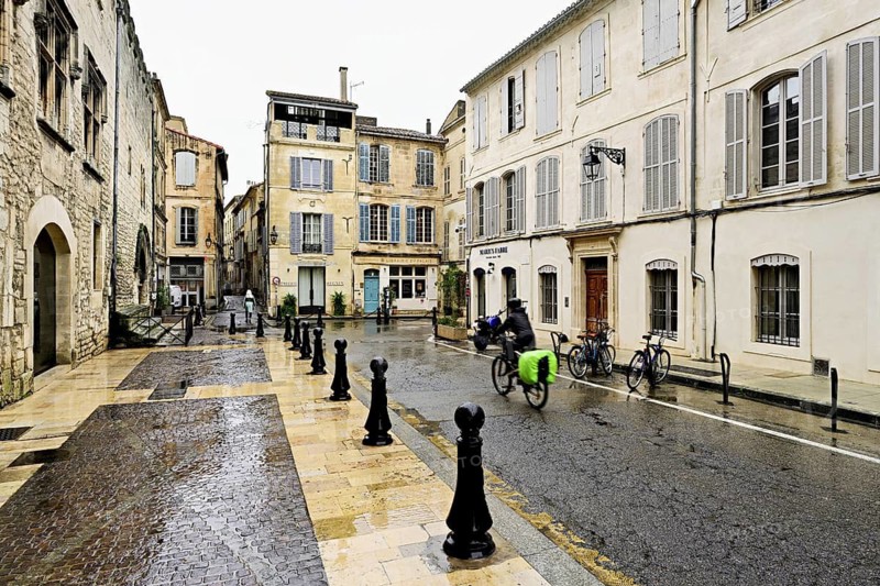 Historic alleyway with cobblestones in the city, Arles, Southern France, France