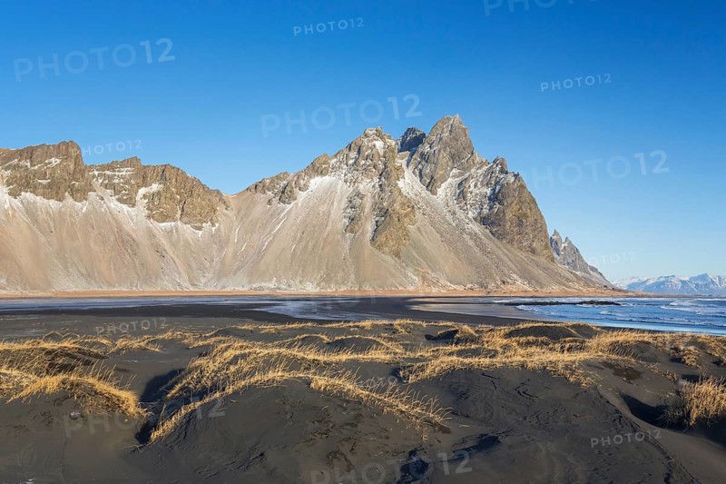 Vestrahorn, Vesturhorn, scree mountain made of gabbro and granophyre rocks, part of the Klifatindur mountain range at Stokksnes in winter, Iceland