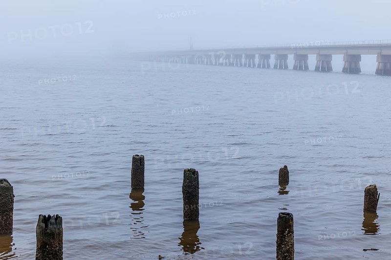 Railroad bridge over the Biloxi Bay disappears into the dense fog at Ocean Springs, Mississippi