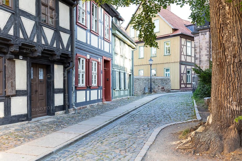 Historic buildings with half-timbered houses at the Oberpfarrkirchhof next to St Sylvestri Church, Old Town of Wernigerode, Harz, Saxony-Anhalt, Germany