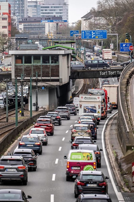 Everyday traffic jam on the A40 motorway, Ruhrschnellweg, in Essen, a good 5 km traffic jam heading east, Dortmund, near Essen city center, narrow lanes, two-lane, heavy traffic, commuters stuck in motorway traffic, North Rhine-Westphalia, Germany
