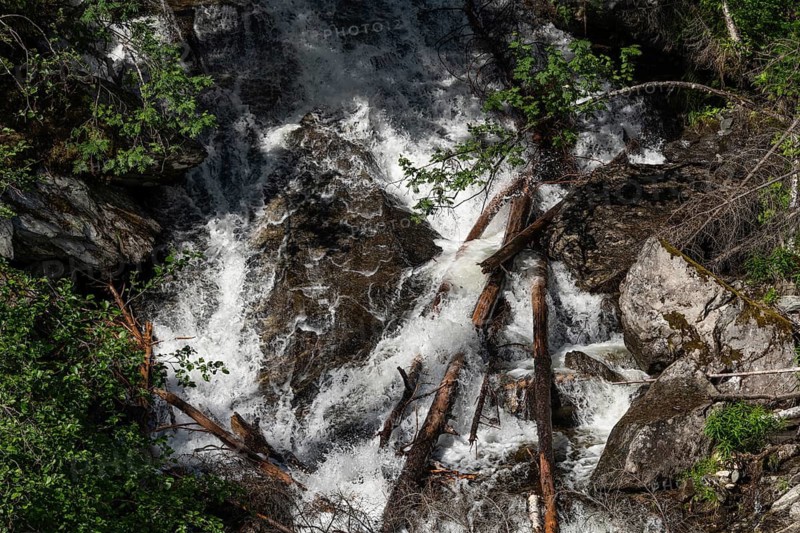 A waterfall cascades down a steep rock face, Roståa stream, near Sel, Gudbrandsdalen, Norway